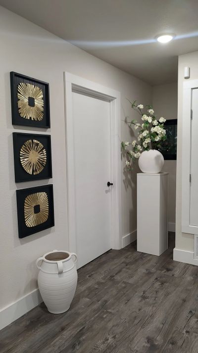 Gold sunburst art trio in corner vignette
