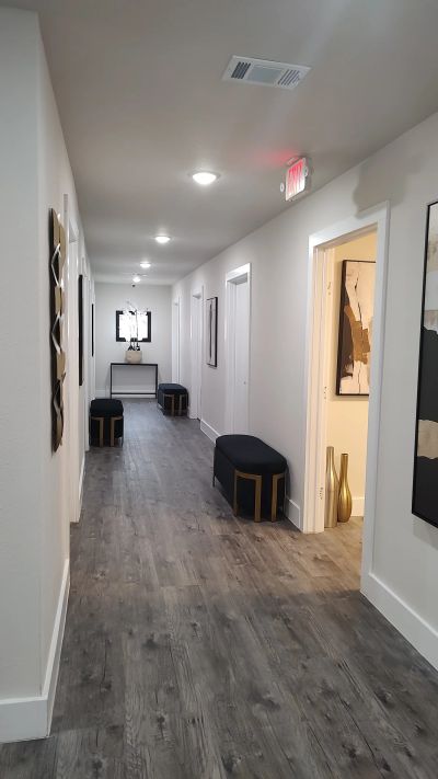 Wide corridor with seating and gallery wall